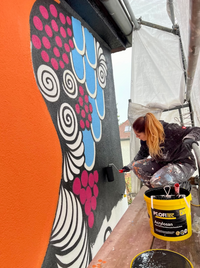 &quot;Gita Kurdpoor painting &#039;Waves of Joy&#039; mural during the final stages at Bernauer Stra&szlig;e 63, Berlin&quot;